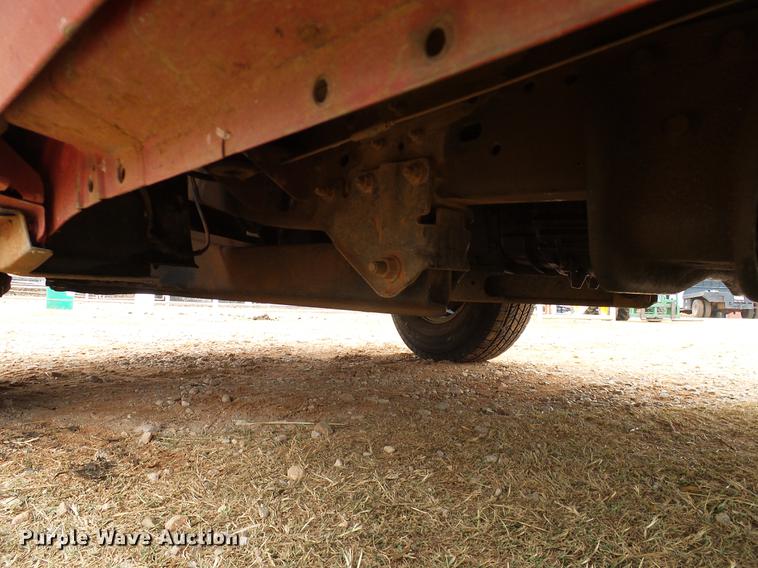 image for item FE9502 1999 Ford F350 Super Duty SuperCab flatbed pickup truck