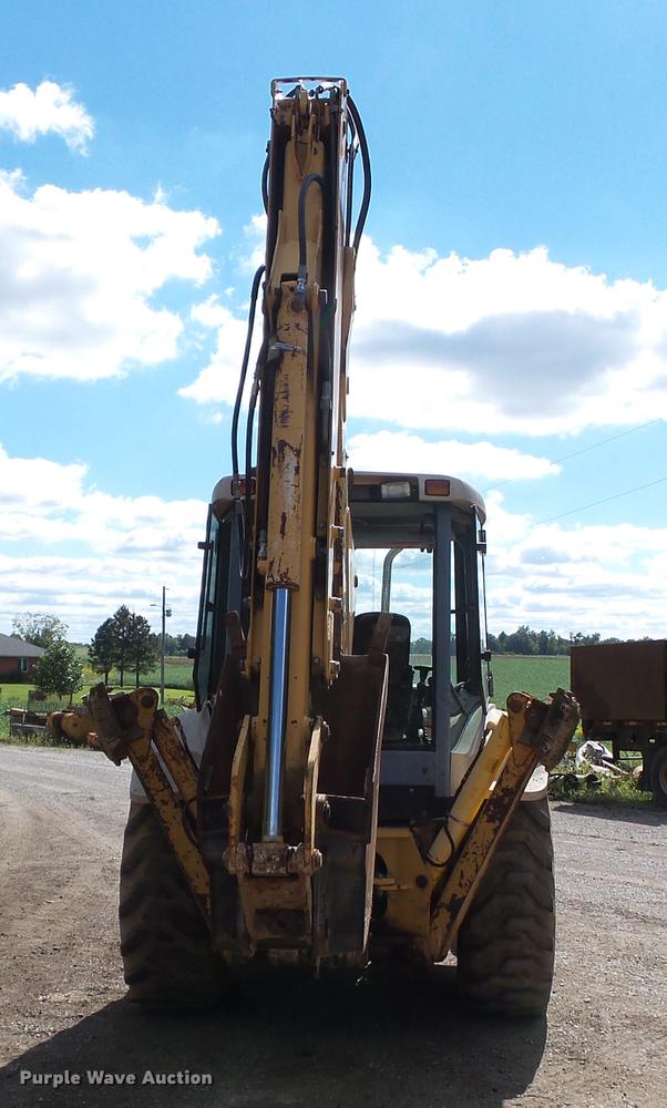 image for item DB7048 1999 New Holland 675E backhoe
