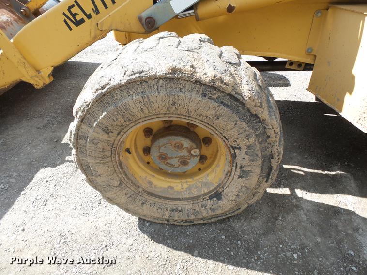 image for item DB7048 1999 New Holland 675E backhoe