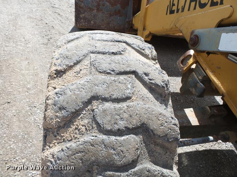 image for item DB7048 1999 New Holland 675E backhoe