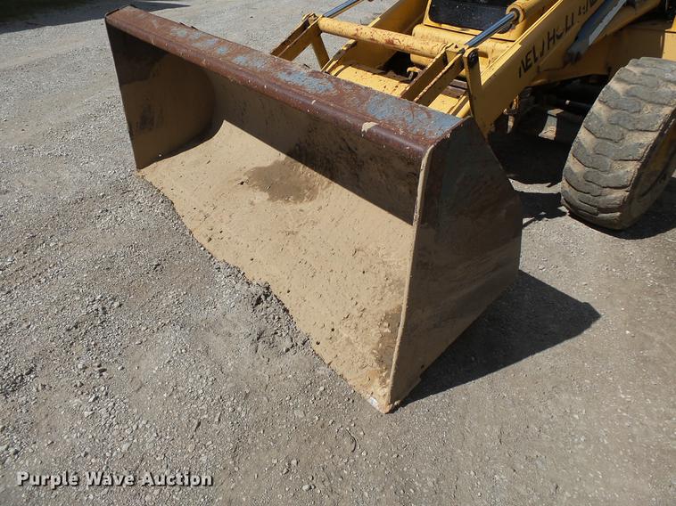 image for item DB7048 1999 New Holland 675E backhoe