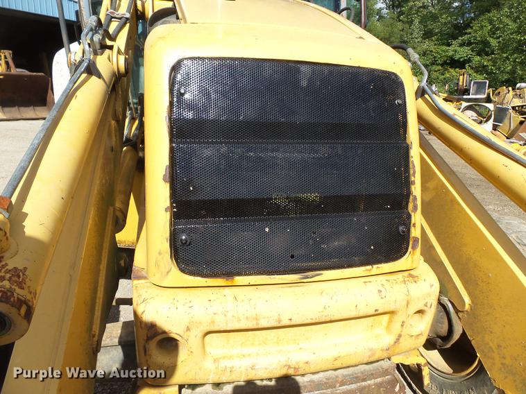 image for item DB7048 1999 New Holland 675E backhoe