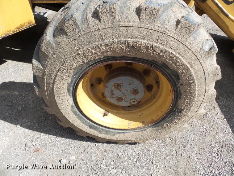 image for item DB7048 1999 New Holland 675E backhoe