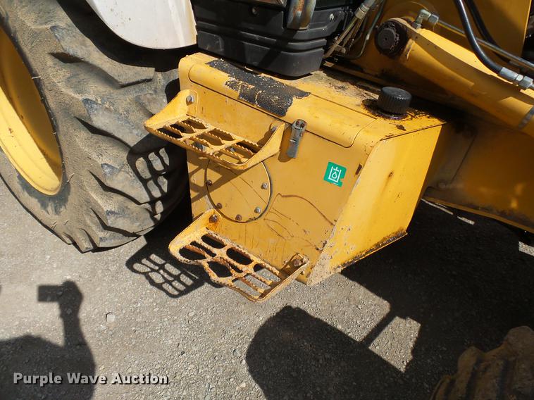 image for item DB7048 1999 New Holland 675E backhoe