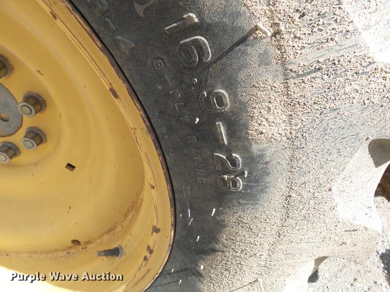 image for item DB7048 1999 New Holland 675E backhoe