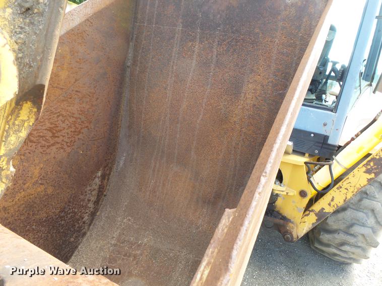 image for item DB7048 1999 New Holland 675E backhoe