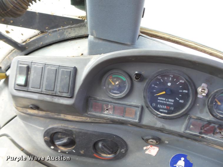 image for item DB7048 1999 New Holland 675E backhoe