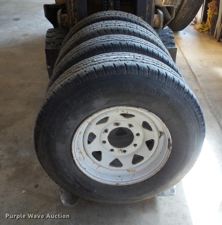 image for item EI9916 (4) 9.50R16.5LT tires and wheels