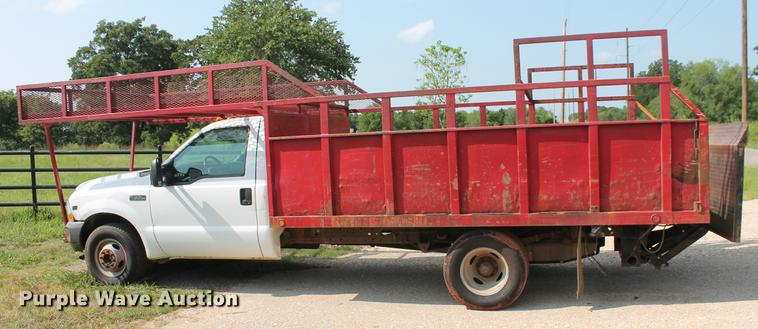 image for item DD5304 2002 Ford F350 Super Duty XL flatbed pickup truck