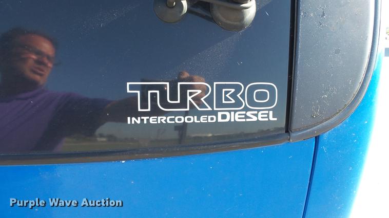 image for item DD7407 2003 Isuzu NPR dump flatbed truck