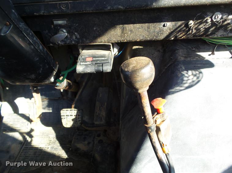 image for item L5702 1990 International 7100 flatbed truck with water tank