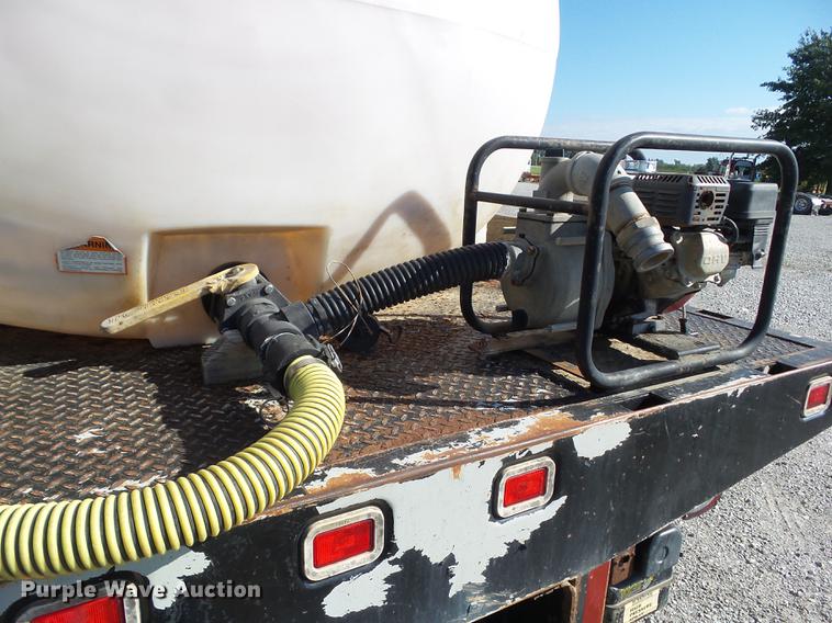 image for item L5702 1990 International 7100 flatbed truck with water tank