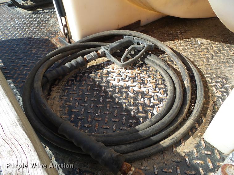 image for item L5702 1990 International 7100 flatbed truck with water tank