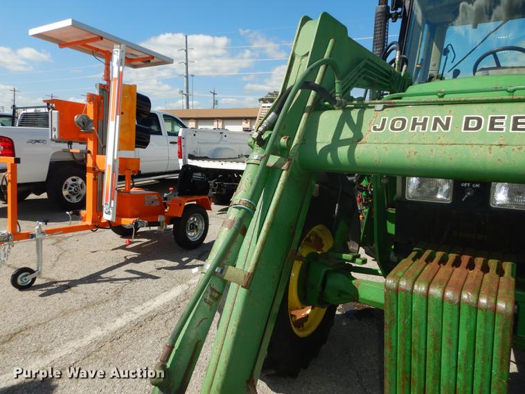 image for item DF1761 2001 John Deere 6310 MFWD tractor