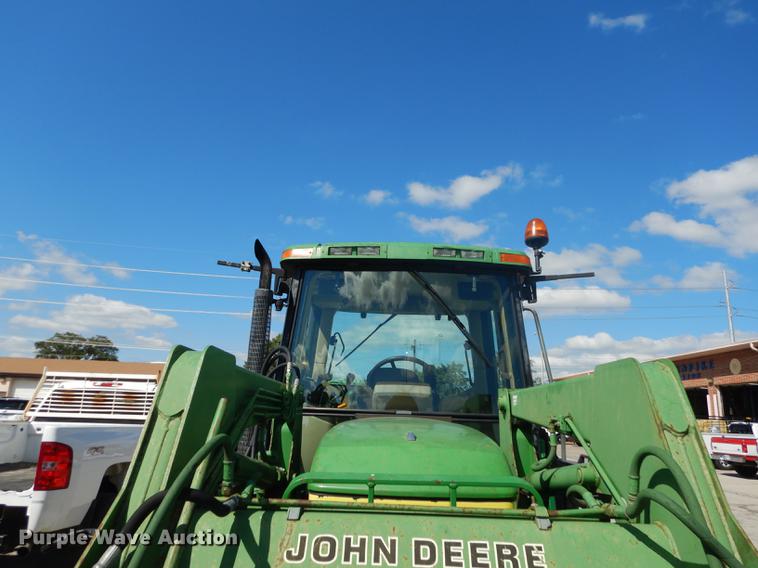 image for item DF1761 2001 John Deere 6310 MFWD tractor