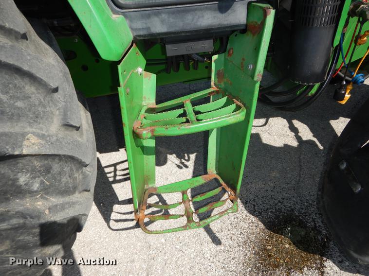 image for item DF1761 2001 John Deere 6310 MFWD tractor
