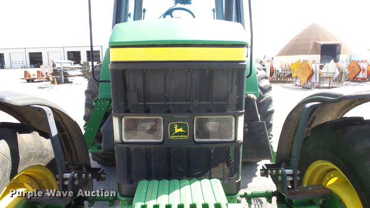 image for item DF4358 1999 John Deere 7210 MFWD tractor