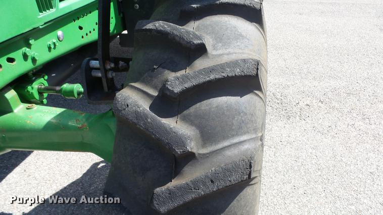 image for item DF4358 1999 John Deere 7210 MFWD tractor