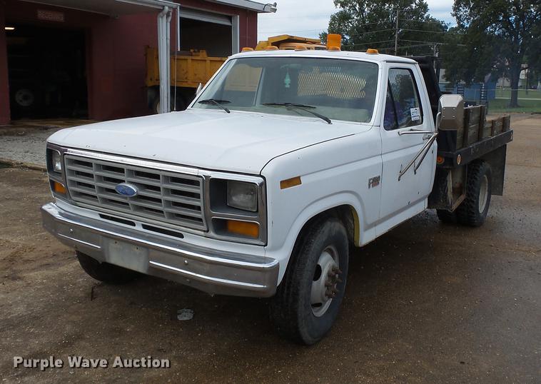 image for item DB7021 1986 Ford F350 dump flatbed pickup truck