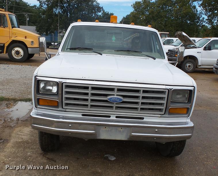 image for item DB7021 1986 Ford F350 dump flatbed pickup truck