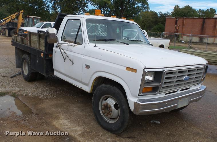 image for item DB7021 1986 Ford F350 dump flatbed pickup truck