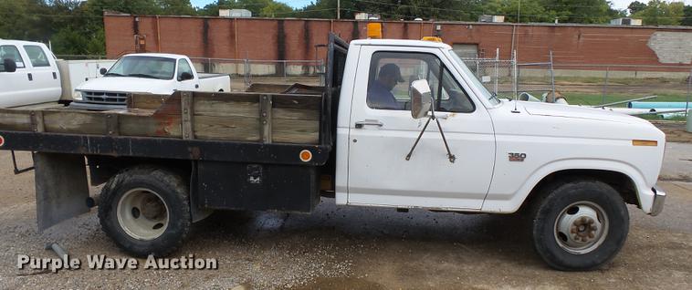 image for item DB7021 1986 Ford F350 dump flatbed pickup truck