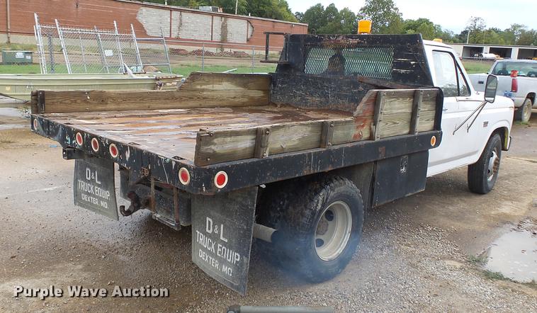 image for item DB7021 1986 Ford F350 dump flatbed pickup truck