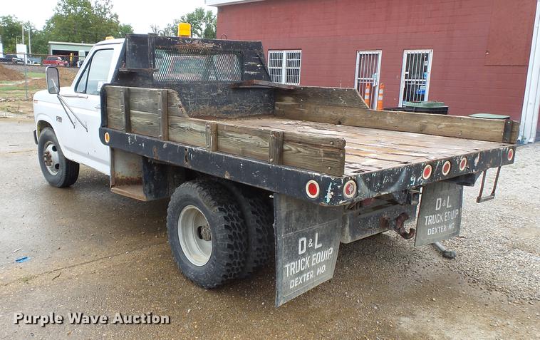 image for item DB7021 1986 Ford F350 dump flatbed pickup truck