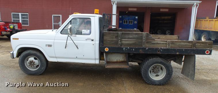 image for item DB7021 1986 Ford F350 dump flatbed pickup truck
