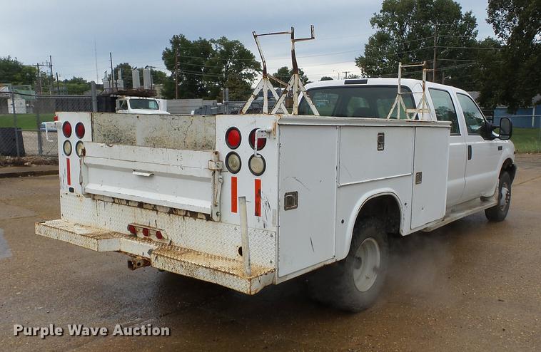 image for item DB7024 2000 Ford F350 Super Duty Crew Cab utility bed pickup truck