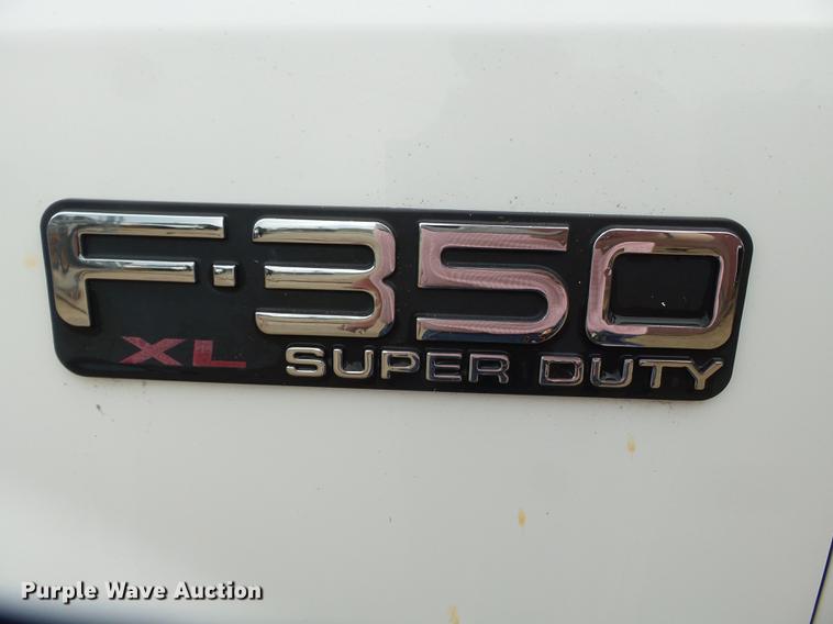 image for item DB7024 2000 Ford F350 Super Duty Crew Cab utility bed pickup truck