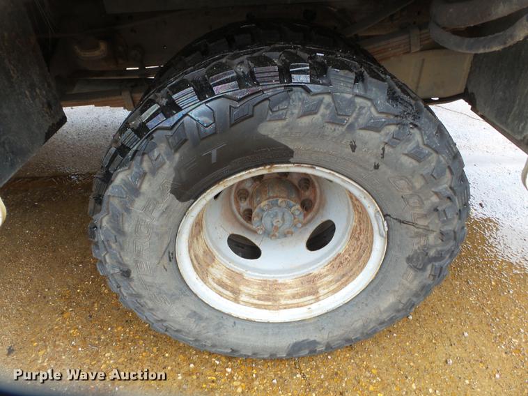 image for item DB7024 2000 Ford F350 Super Duty Crew Cab utility bed pickup truck