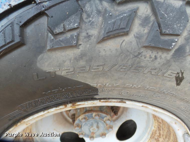 image for item DB7024 2000 Ford F350 Super Duty Crew Cab utility bed pickup truck