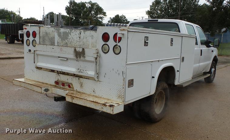 image for item DB7025 2001 Ford F350 Super Duty Crew Cab utility bed pickup truck