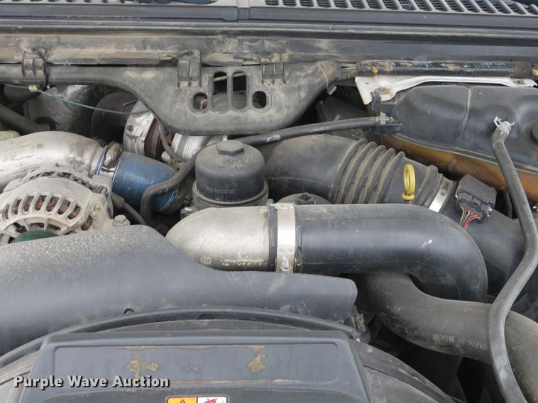 image for item DB8988 2006 Ford F350 Super Duty Crew Cab flatbed pickup truck