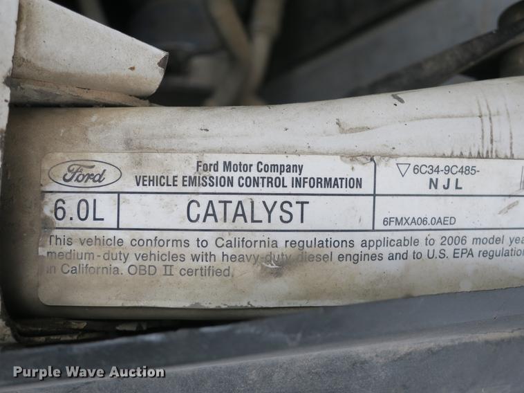 image for item DB8988 2006 Ford F350 Super Duty Crew Cab flatbed pickup truck