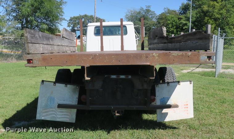 image for item DB8975 2000 International 4700 flat dump bed truck