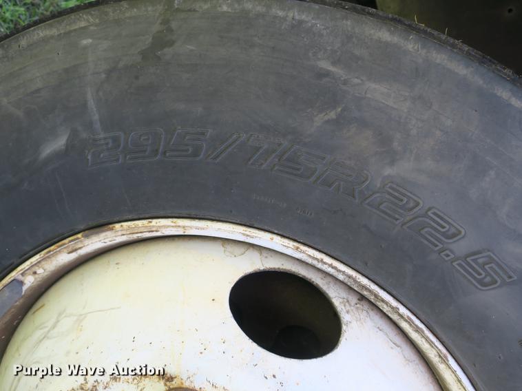 image for item DB8975 2000 International 4700 flat dump bed truck