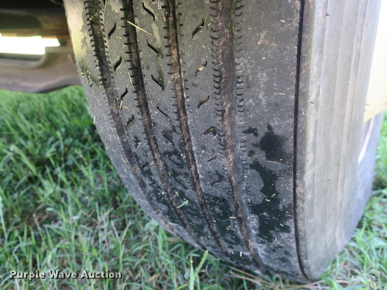 image for item DB8975 2000 International 4700 flat dump bed truck