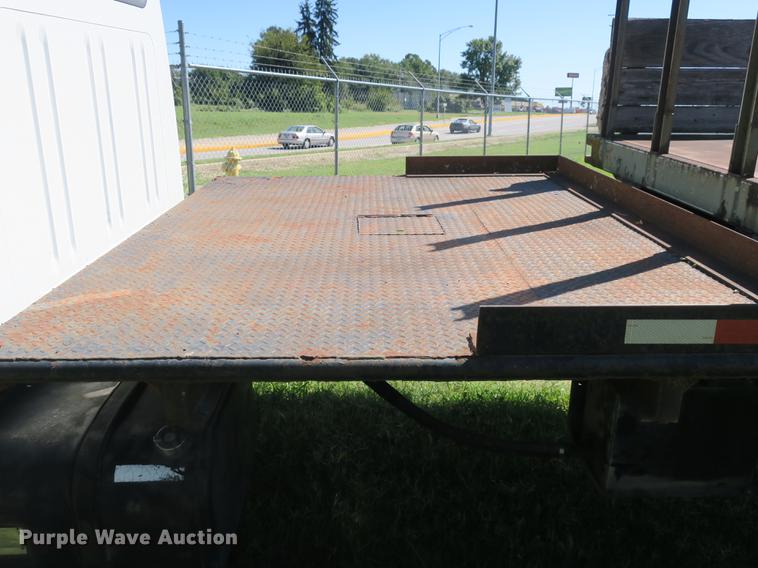 image for item DB8975 2000 International 4700 flat dump bed truck