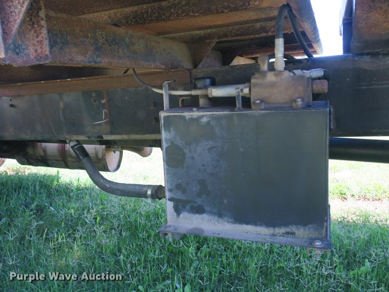 image for item DB8975 2000 International 4700 flat dump bed truck