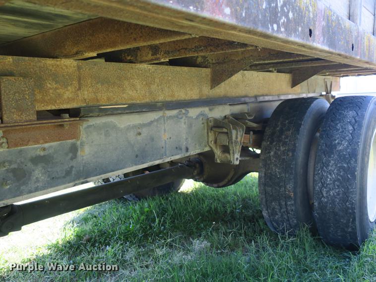 image for item DB8975 2000 International 4700 flat dump bed truck