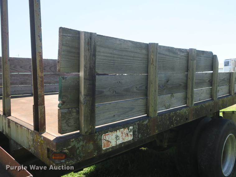 image for item DB8975 2000 International 4700 flat dump bed truck