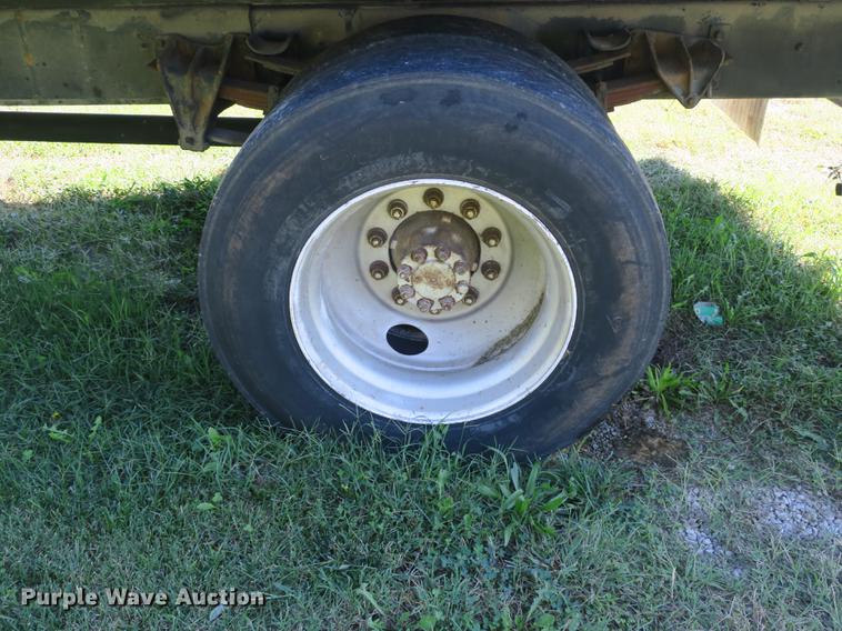 image for item DB8975 2000 International 4700 flat dump bed truck