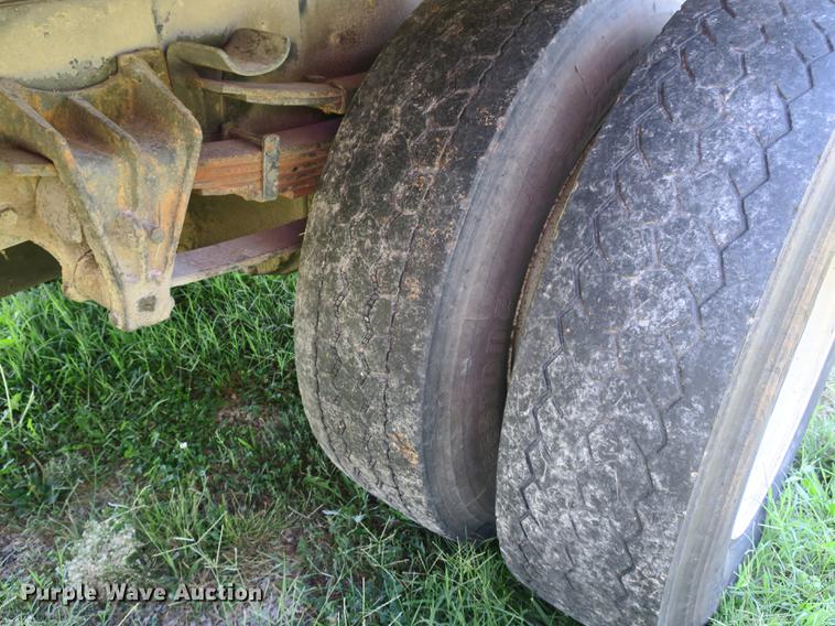 image for item DB8975 2000 International 4700 flat dump bed truck