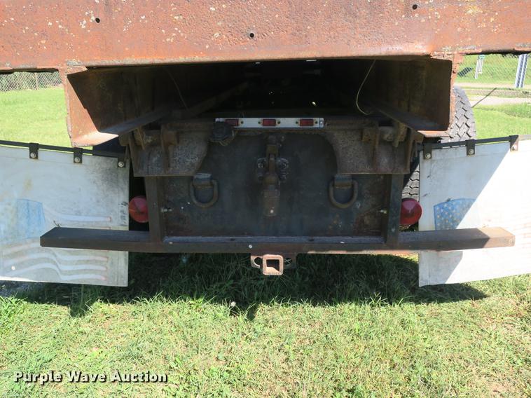 image for item DB8975 2000 International 4700 flat dump bed truck