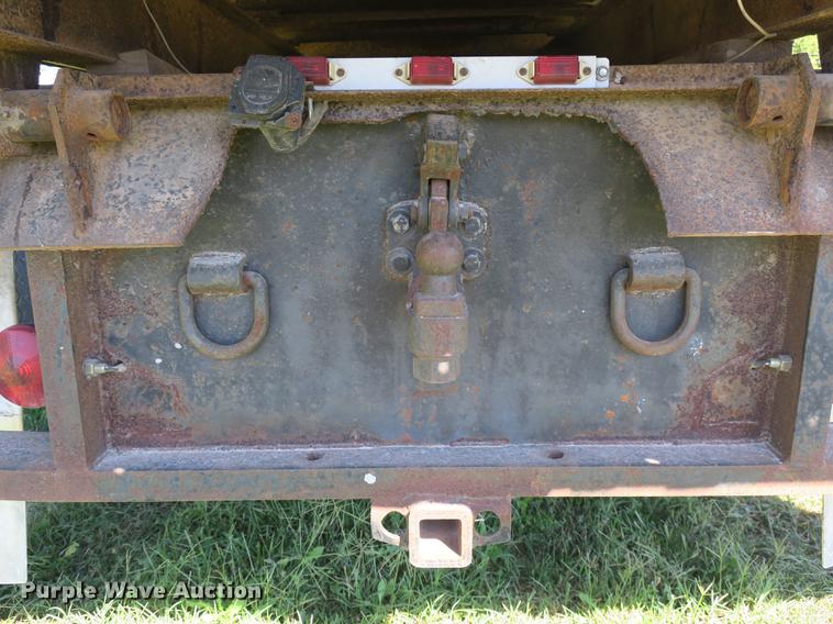 image for item DB8975 2000 International 4700 flat dump bed truck