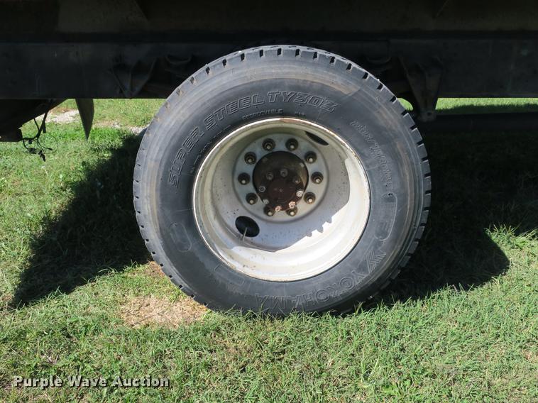 image for item DB8975 2000 International 4700 flat dump bed truck