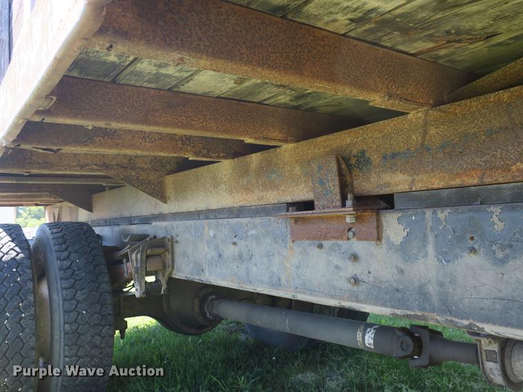 image for item DB8975 2000 International 4700 flat dump bed truck