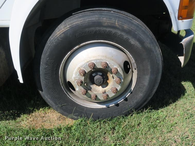 image for item DB8975 2000 International 4700 flat dump bed truck